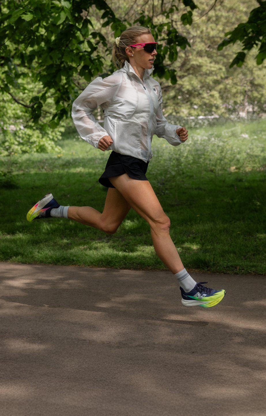 Woman running wearing new balance SC elites